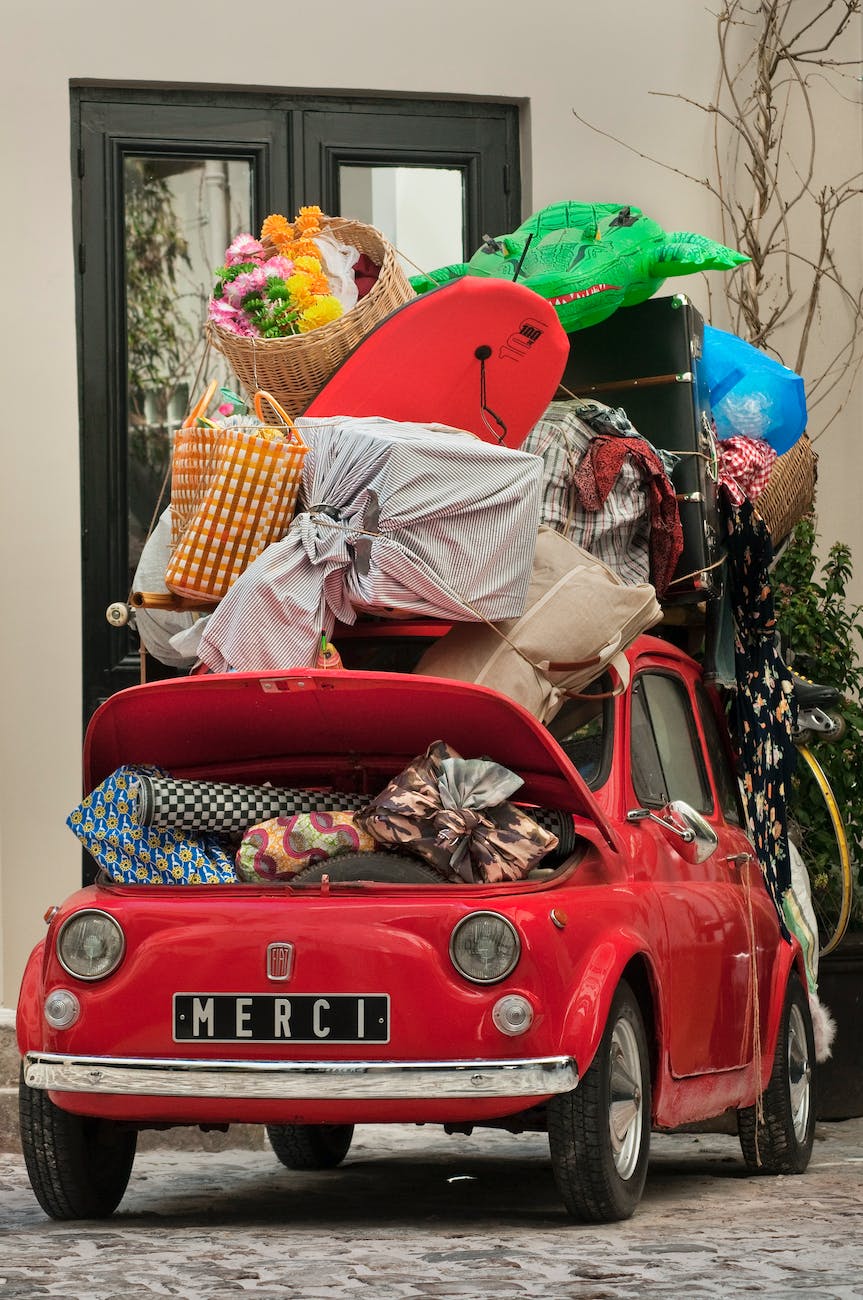 luggage in a little red car