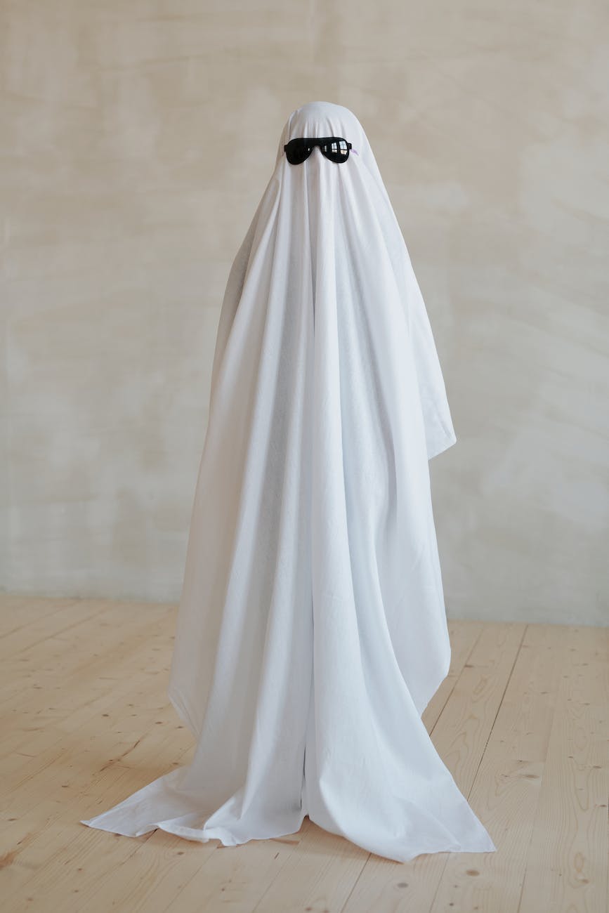 person wearing white halloween costume against white background